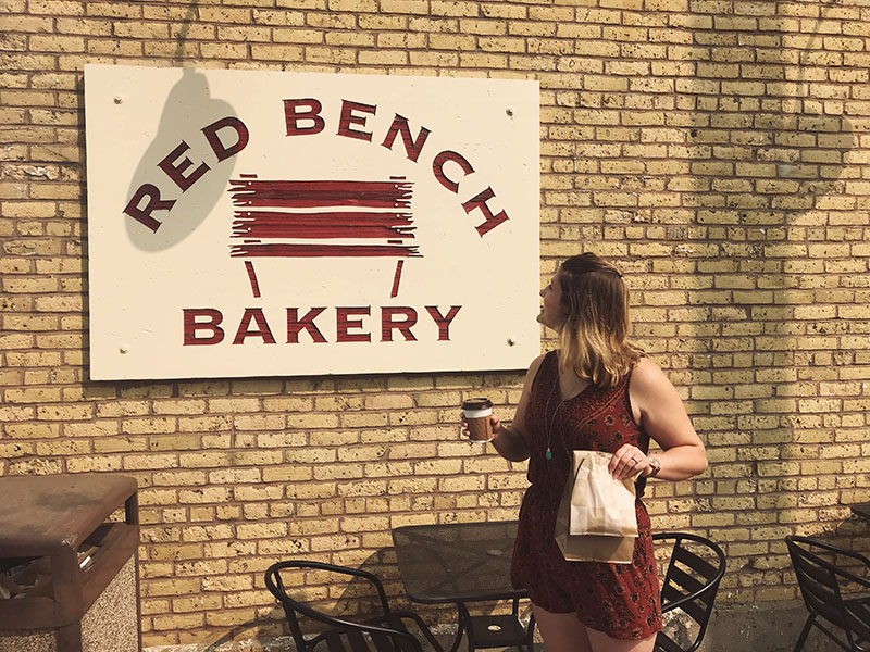 Checking out the new sign and old brick.