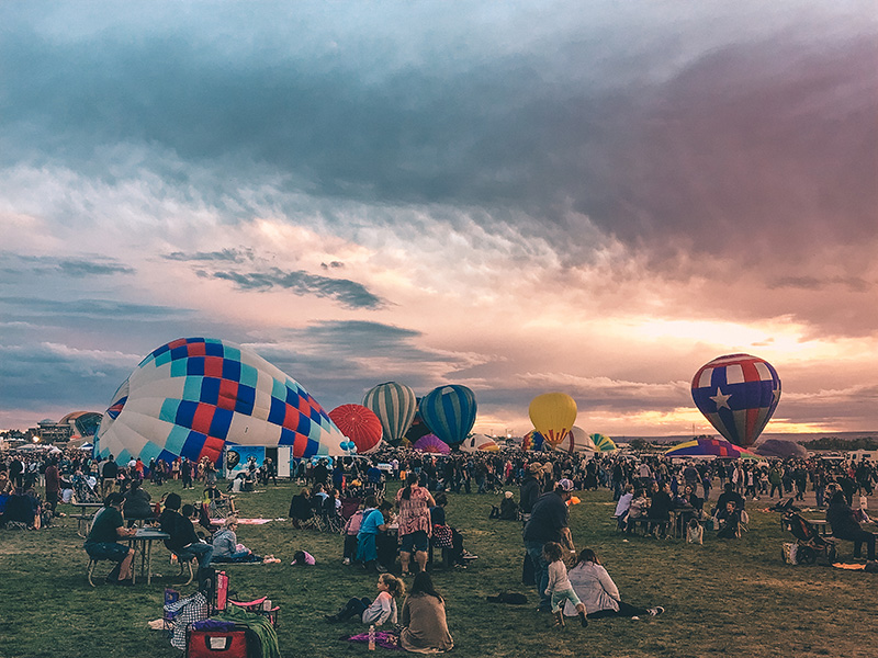 The fields are almost as covered in balloons as they are in people.