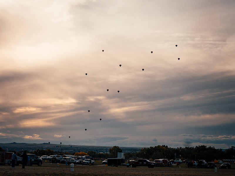 A sprinkling of balloons in the distance.